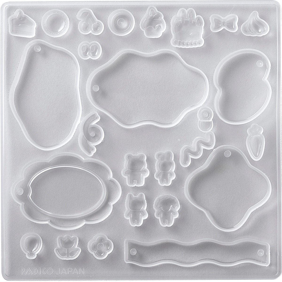 Muotti, joustava ja l�pin�kyv�, "PUHEKUPLA #1 KUVIOITA" Kokelma jossa 6 isompaa muotoa ja 20 pient� osaa niiden koristeluun. Tee esim avainperi� ja asustekoristeita (UV-led hartsille, massoille)